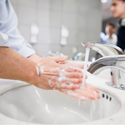 Handwashing in restroom with PURELL CXR REDIFOAM System